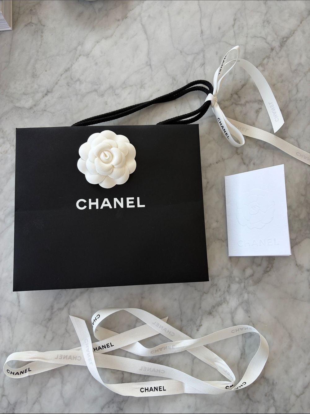 CHANEL Black Bag with White Camellia, Ribbon, and Envelope Bundle!